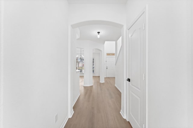 hallway with light wood-type flooring