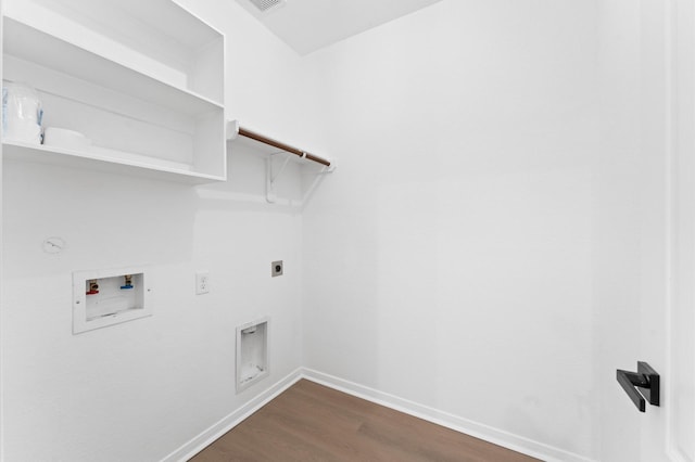 laundry room with gas dryer hookup, washer hookup, dark hardwood / wood-style flooring, and electric dryer hookup