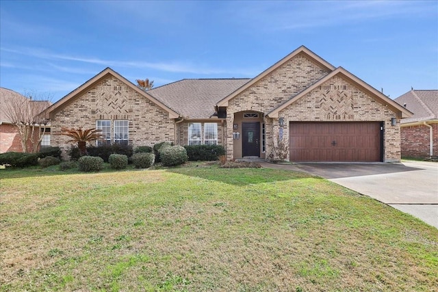 view of front of home with a garage and a front lawn