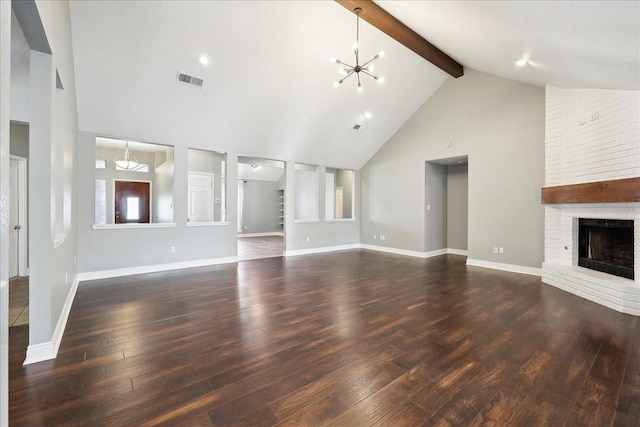 unfurnished living room with high vaulted ceiling, a brick fireplace, dark hardwood / wood-style flooring, a notable chandelier, and beamed ceiling