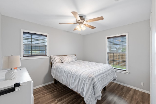 bedroom with ceiling fan and dark hardwood / wood-style flooring