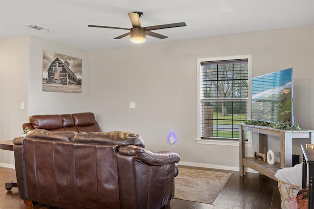 living room with hardwood / wood-style flooring and ceiling fan