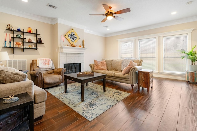 125 Indian Warrior Trl, Lake Jackson, TX 77566 - living room with crown molding, ceiling fan, and a fireplace