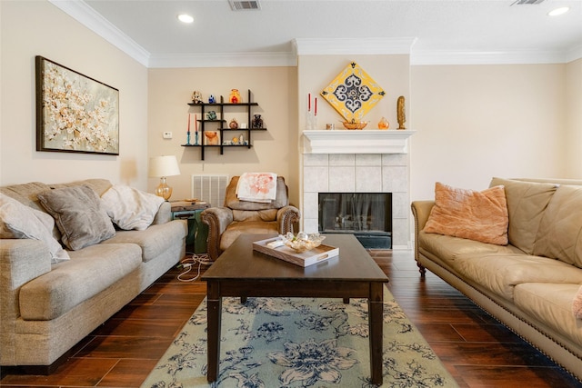 125 Indian Warrior Trl, Lake Jackson, TX 77566 - living room featuring ornamental molding, dark hardwood / wood-style floors, and a tile fireplace