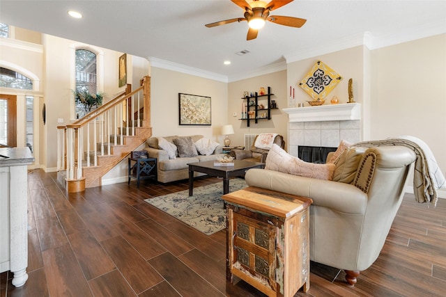 125 Indian Warrior Trl, Lake Jackson, TX 77566 - living room with ceiling fan, ornamental molding, dark hardwood / wood-style floors, and a tile fireplace