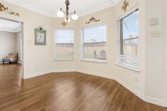 125 Indian Warrior Trl, Lake Jackson, TX 77566 - unfurnished dining area with crown molding, dark hardwood / wood-style floors, and a notable chandelier