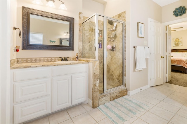 125 Indian Warrior Trl, Lake Jackson, TX 77566 - bathroom with tile patterned floors, a shower with door, and vanity