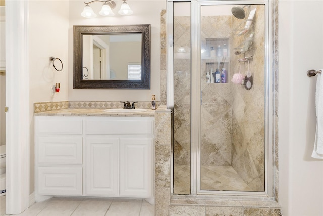 125 Indian Warrior Trl, Lake Jackson, TX 77566 - bathroom with vanity, toilet, tile patterned floors, and a shower with shower door
