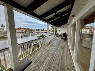 wooden terrace with a water view