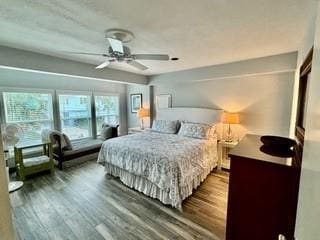 bedroom featuring ceiling fan and dark hardwood / wood-style flooring