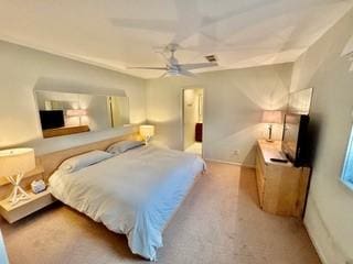 bedroom with ceiling fan and light carpet