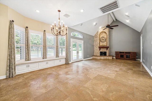 unfurnished living room with ceiling fan with notable chandelier, high vaulted ceiling, a stone fireplace, french doors, and beamed ceiling