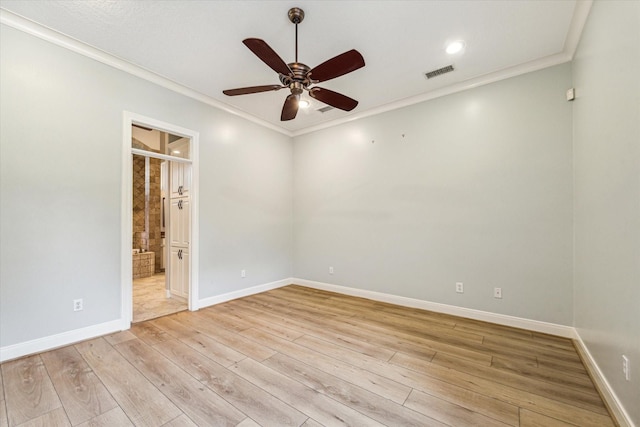 empty room with crown molding, light hardwood / wood-style floors, and ceiling fan