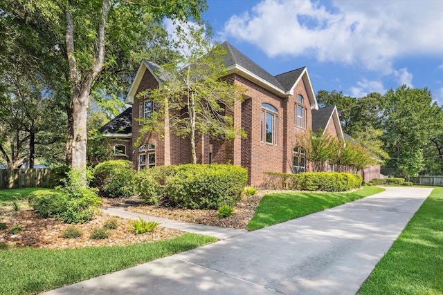 view of side of home featuring a yard