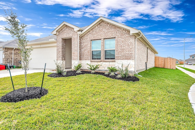 view of front of home with a garage and a front yard