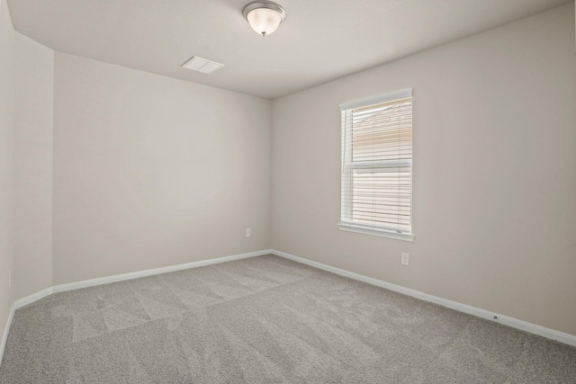 empty room featuring light colored carpet