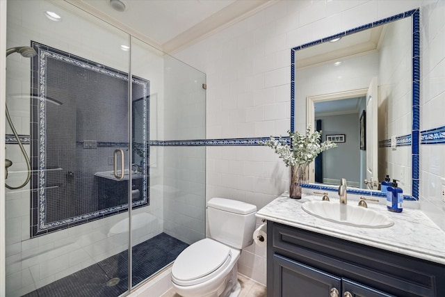 bathroom with walk in shower, toilet, crown molding, tile walls, and vanity