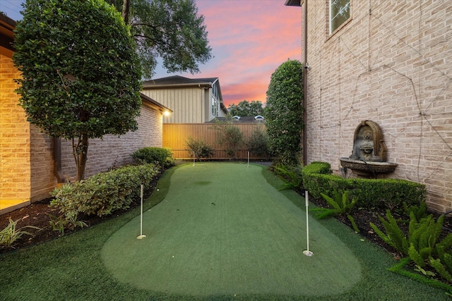 view of yard at dusk