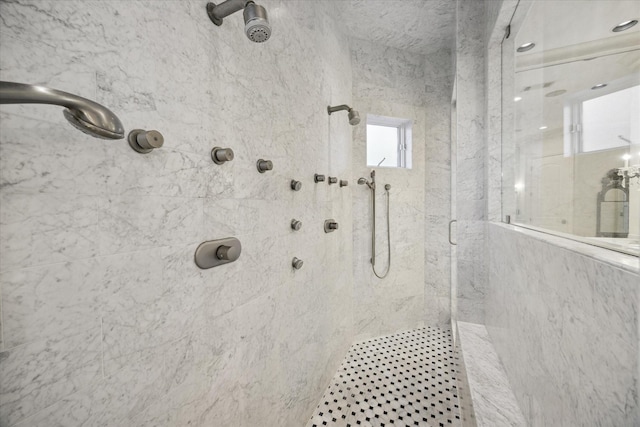 bathroom with tiled shower