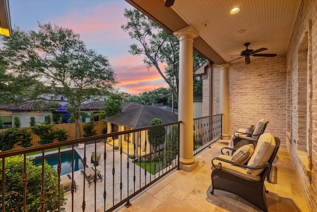 balcony at dusk with ceiling fan