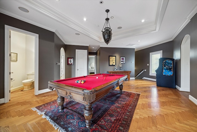 playroom featuring ornamental molding, light parquet flooring, and a raised ceiling