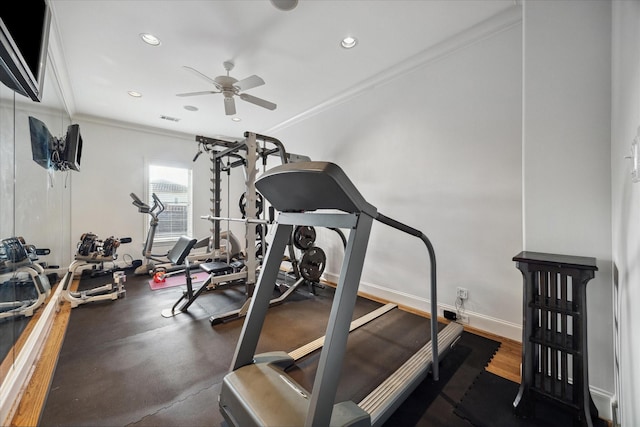 exercise room featuring ceiling fan and ornamental molding