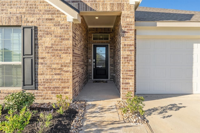 entrance to property featuring a garage