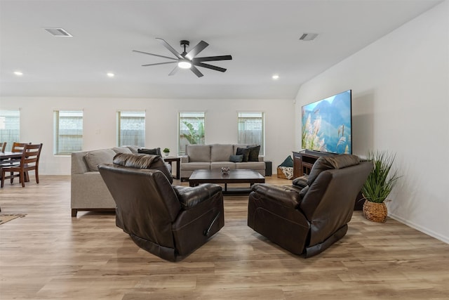 living room with ceiling fan, light hardwood / wood-style floors, and a wealth of natural light