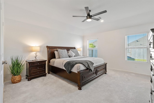 bedroom featuring ceiling fan and light carpet