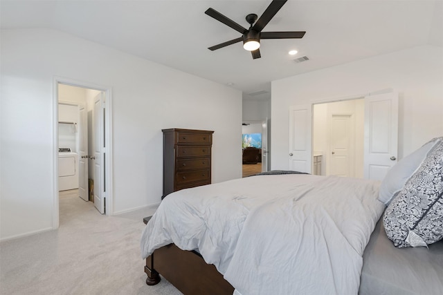 bedroom featuring washer / dryer, vaulted ceiling, light colored carpet, and ceiling fan