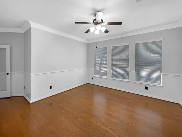 unfurnished room featuring wood-type flooring, ornamental molding, and ceiling fan