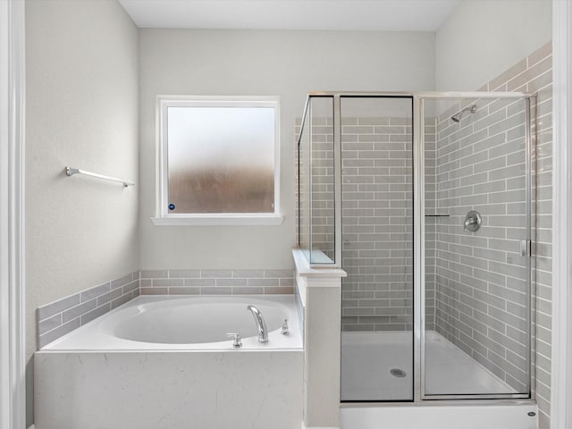 bathroom with shower with separate bathtub