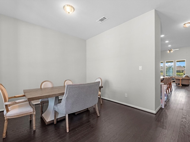 dining room with dark hardwood / wood-style floors