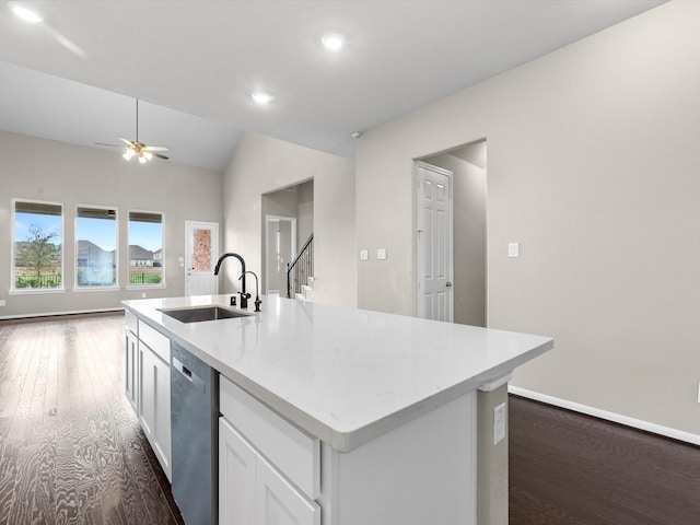 kitchen with dishwasher, an island with sink, sink, white cabinets, and dark hardwood / wood-style flooring