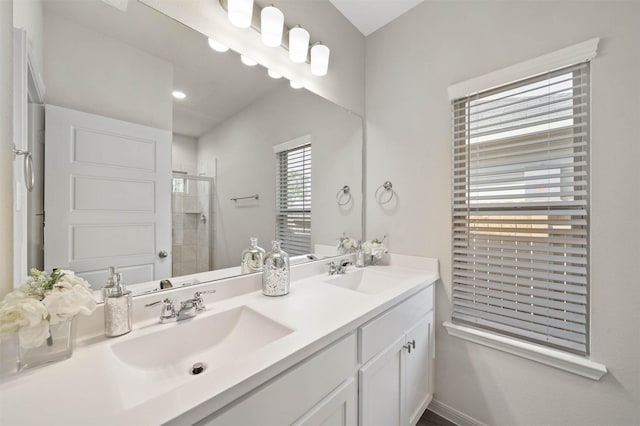 bathroom featuring vanity and a shower with shower door