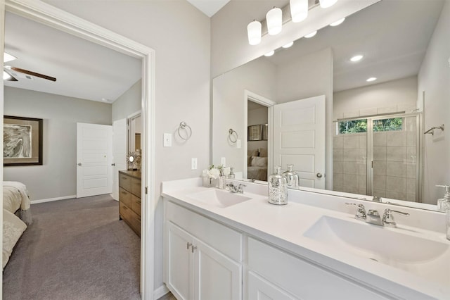 bathroom featuring vanity, ceiling fan, and walk in shower