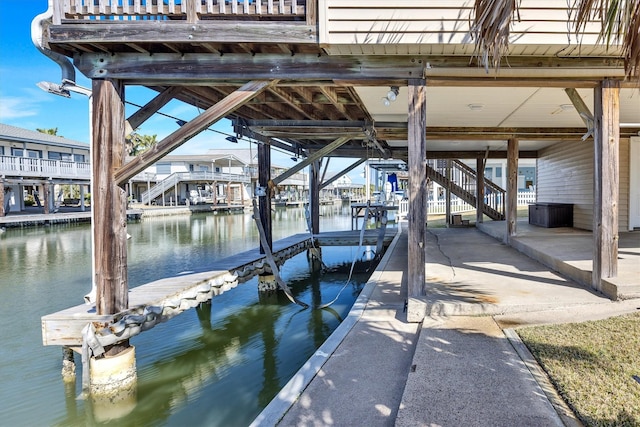 dock area with a water view