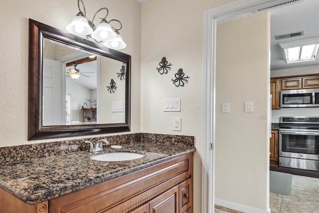 bathroom featuring vanity and ceiling fan