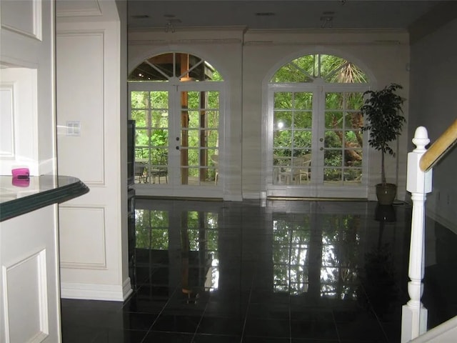 doorway featuring dark tile patterned floors