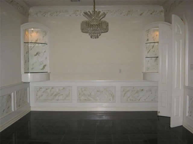 interior space featuring an inviting chandelier and ornamental molding