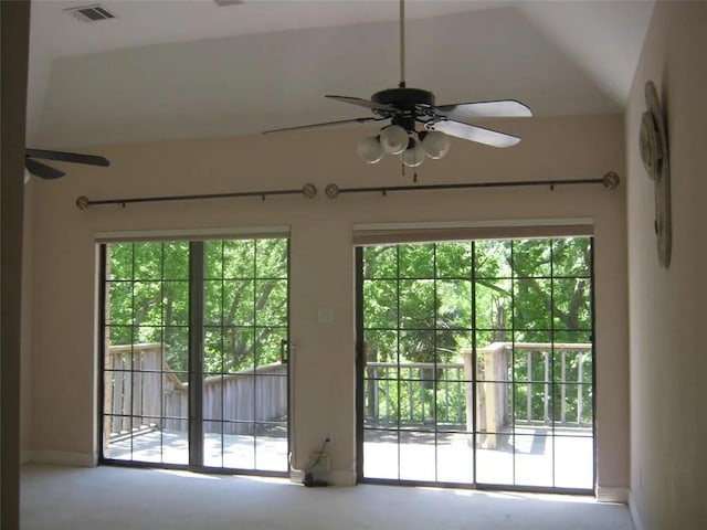 entryway with lofted ceiling, ceiling fan, and a healthy amount of sunlight