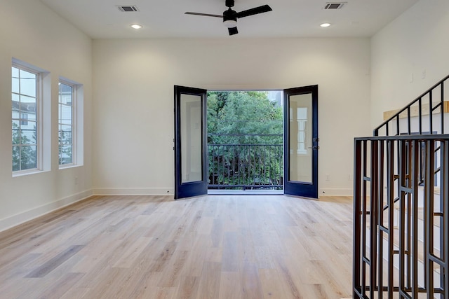 foyer entrance featuring ceiling fan and light hardwood / wood-style flooring