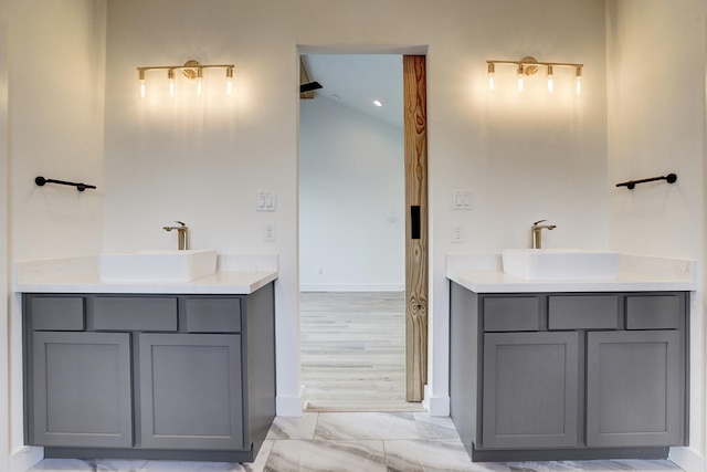 2221 Bevis St, Houston, TX 77008 - bathroom with vanity, lofted ceiling, and marble look tiles