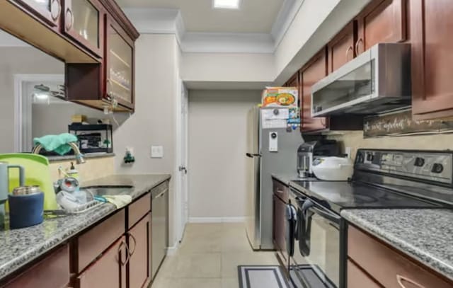 kitchen featuring crown molding, dark brown cabinets, light tile patterned flooring, and appliances with stainless steel finishes