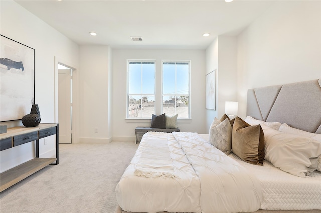 bedroom with light carpet, baseboards, visible vents, and recessed lighting