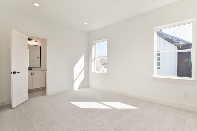 unfurnished bedroom featuring recessed lighting, carpet flooring, and baseboards