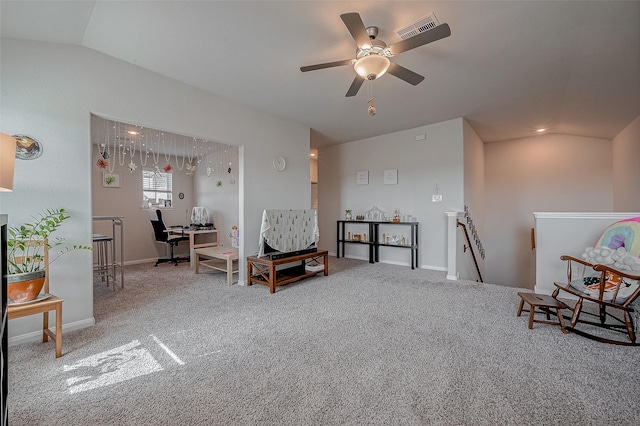 sitting room featuring ceiling fan, vaulted ceiling, and carpet