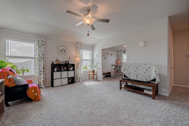 sitting room featuring ceiling fan, lofted ceiling, and carpet flooring