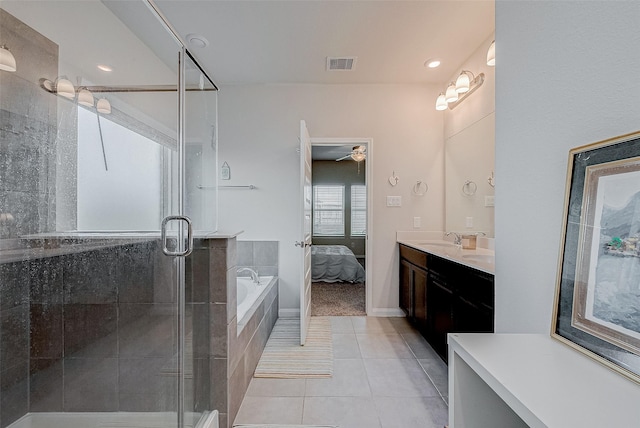 bathroom featuring vanity, tile patterned floors, plus walk in shower, and ceiling fan