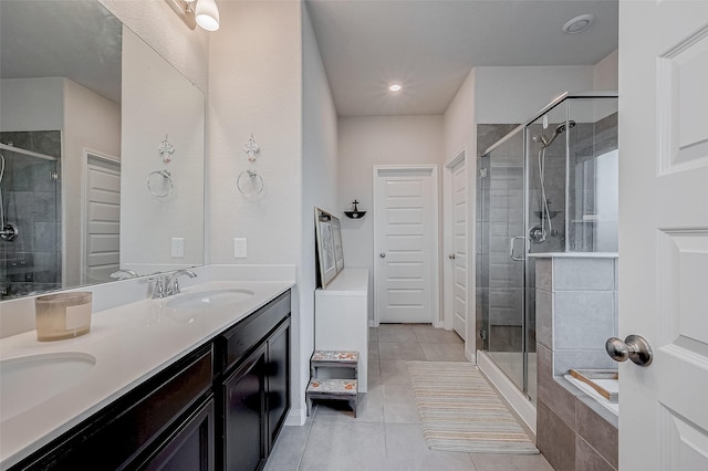 bathroom featuring tile patterned flooring, vanity, and shower with separate bathtub